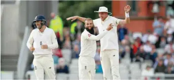  ?? — Reuters ?? England’s Moeen Ali celebrates taking the wicket of South Africa’s Duanne Olivier and winning the fourth Test match with Stuart Broad at Old Trafford.