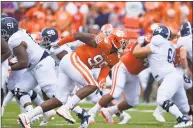  ?? Richard Shiro / Associated Press ?? Clemson’s Clelin Ferrell rushes into the backfield against Georgia Southern. Ferrell, an explosive pass rusher, has a ton of NFL upside according to scouts.