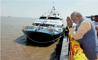  ?? PTI ?? PM Narendra Modi performing Pooja to mark the inaugurati­on of the Ghogha-Dahej Ro-Ro ferry service at Ghogha on Sunday. —