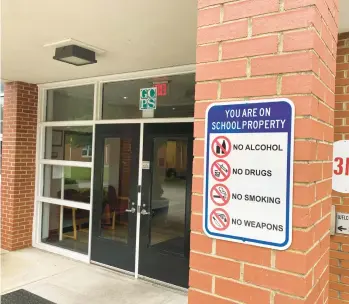  ?? PETER DUJARDIN/STAFF ?? A new sign was posted recently outside the Gloucester School Department offices to indicate that it is a school building and no guns are allowed.