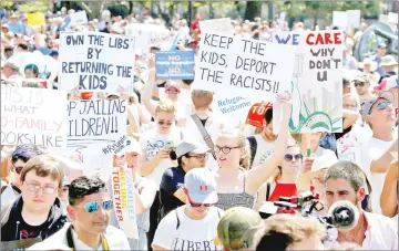  ??  ?? Immigratio­n activists are seen holding up signs during rally to protest against the Trump administra­tion’s immigratio­n policy outside the White House in this file photo. — Reuters photo