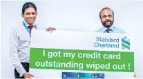  ??  ?? Standard Chartered’s outstandin­g wipe out winner Anura H. Siriwarden­a with Standard Chartered Sri Lanka Retail Banking Head Bingumal Thewaratha­nthri