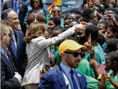  ?? MISPER APAWU / AP ?? Vice President Kamala Harris greets school children during her arrival ceremony at Kotoka Internatio­nal Airport in Accra, Ghana Sunday.