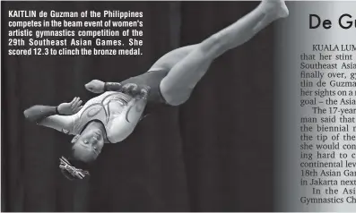  ??  ?? KAITLIN de Guzman of the Philippine­s competes in the beam event of women's artistic gymnastics competitio­n of the 29th Southeast Asian Games. She scored 12.3 to clinch the bronze medal.