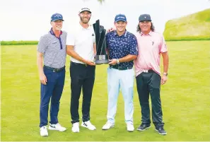  ?? The Associated Press ?? ■ The “4 Aces” team gathers for a picture after winning the team competitio­n of the Bedminster Invitation­al LIV Golf tournament in Bedminster, N.J., Sunday. From left, Talor Gooch, Dustin Johnson, Patrick Reed and Pat Perez.