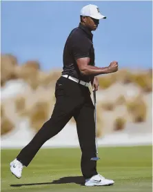  ?? AP PHOTO ?? PUMPED: Tiger Woods reacts after sinking a putt on No. 4 yesterday in Nassau, Bahamas, in his first tournament action since February.