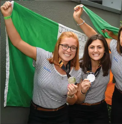  ??  ?? Ireland players, from left, Zoe Wilson, Roisin Upton, Deirdre Duke and Lena Tice during the Irish Hockey Squad hom ecoming from the Women’s Hockey World Cup at Dublin Airport in Dublin.