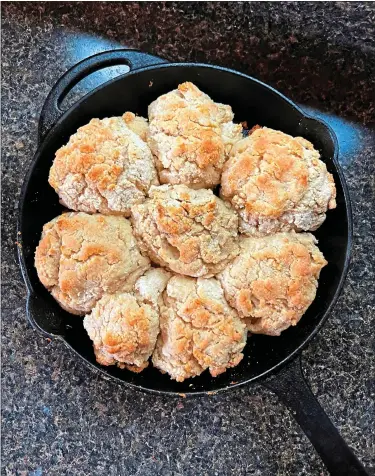  ?? PHOTOS BY GRETCHEN MCKAY — TRIBUNE NEWS SERVICE ?? A staple of the South, drop biscuits can be made quickly in a cast-iron pan and serve as a delicious base for sandwiches. This will cook out the taste of the flour.
Return the sausage to the gravy, and finish by adding your salt, pepper, red pepper flakes and thyme, if using. Bring this mixture to light simmer then remove from heat. Pour over a fresh-from-the-oven biscuit and serve. Serves 4, with leftover gravy,
— “Biscuit Head: New Southern Biscuits, Breakfasts and Brunch” by Jason and Carolyn Roy.
This garlicky, slightly spicy sauce is the perfect topping for a fried chicken biscuit.