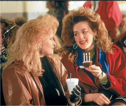  ??  ?? Melanie Griffith in Working Girl knew all about the importance of ‘’serious hair’'.