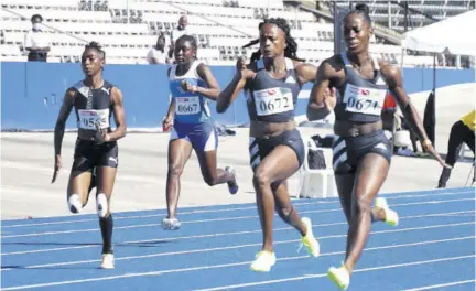  ?? (Photo: Dwayne Richards) ?? Shashalee Forbes (right) of Sprintec pulls aways from her teammate Remona Burchell (2nd right) to win the women’s 100m in a season’s best 11.17s at the JAAA Qualificat­ion Trial Series at National Stadium in Kingston yesterday. Burchell was second in 11.39s.