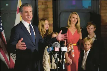  ?? RICH PEDRONCELL­I/AP ?? California Gov. Gavin Newsom, accompanie­d by his family, speaks after winning a second term in office on Tuesday in Sacramento. California voters overwhelmi­ngly decided to add abortion rights to the state constituti­on.