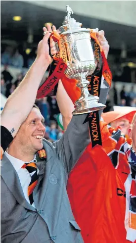  ?? Picture: SNS Group. ?? Dundee United captain Andy Webster and the man he took over the role from, Lee Wilkie, lift the Scottish Cup after the victory over Ross County at Hampden in 2010.