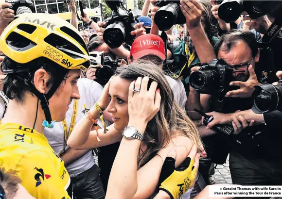  ??  ?? &gt; Geraint Thomas with wife Sara in Paris after winning the Tour de France