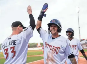  ?? CHRIS KOHLEY / USA TODAY ?? Brice Turang, center, could be one of the prospects sent to Appleton with the pool of players eligible for the major-league season.