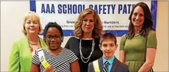  ??  ?? Outstandin­g AAA School Safety Patrol Members Nhaomi Lartey of Ardmore Avenue School and Michael Tully of Garrettfor­d Elementary School are pictured in front. Pictured in back are Susan Meade-Beachell, Executive Director, Mid-Atlantic Foundation for...