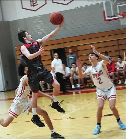  ?? Photo by Ernest A. Brown ?? Lincoln senior Josh Jahnz glides down the lane for a bucket in the No. 11 Lions’ Open state tournament game against East Providence. Offense wasn’t an issue for the D-III champs, but they couldn’t slow down the Townies in a 101-82 defeat Thursday night.