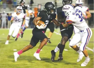  ?? STAFF PHOTO BY ERIN O. SMITH ?? Ridgeland’s Jordan Blackwell carries the ball during the Panthers’ home game against Northwest Whitfield on Oct. 4. The Panthers lost, but it set up a major turning point in their season.