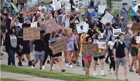  ?? RICK WOOD/USA TODAY NETWORK ?? Demonstrat­ors marched through Milwaukee on Saturday to protest police brutality and racial injustice after the death of George Floyd at the hands of a Minneapoli­s police officer.