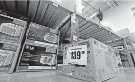  ?? [AP FILE PHOTO] ?? Fans and air conditione­rs are seen for sale at a hardware store in Seattle. A federal judge in San Francisco on Thursday has ordered the Trump administra­tion to implement energyuse limits for portable air conditione­rs and other products that were...