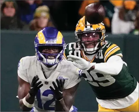  ?? (AP/Morry Gash) ?? Green Bay Packers cornerback Rasul Douglas (right) breaks up a pass intended for Van Jefferson of the Los Angeles Rams on Nov. 28. Douglas has been a big contributo­r for the Packers since being picked up from the Arizona Cardinals’ practice squad in early October.