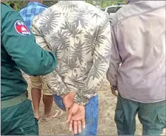  ?? SUPPLIED ?? Seang Bunnal, deputy police chief of Ba Phnom district in Prey Veng province, is arrested over a shooting during a cockfighti­ng raid that seriously injured a man.