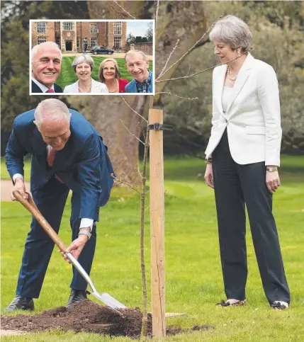  ??  ?? POSTERITY TREE: Prime Minister Malcolm Turnbull and British PM Theresa May plant an English oak tree in the grounds of her country residence. Inset: Malcolm Turnbull, Theresa May, Lucy Turnbull and Philip May.