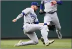  ?? NICK WASS — THE ASSOCIATED PRESS ?? Dodgers left fielder Gavin Lux misses a ball that went for single by the Nationals' Josh Bell,