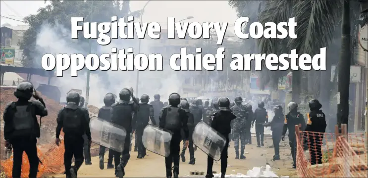  ?? Photo: Nampa/AFP ?? Standoff… Ivorian anti-riot police use tear gas to disperse opposition supporters in Blockhauss, Abidjan, during Ivory Coast’s recent presidenti­al election.