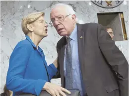  ?? AP PHOTO ?? TO EVERYONE’S HEALTH: Elizabeth Warren joins forces with Bernie Sanders to try to extend Medicare to everyone.