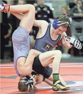  ?? MARK HOFFMAN / MILWAUKEE JOURNAL SENTINEL ?? Marquette senior Tom Dineen (right) recovered from a broken foot in time to make a postseason run that resulted in his second straight WIAA state tournament berth.