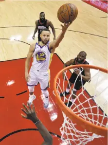  ??  ?? Warriors guard Stephen Curry hit a number of floaters and layups en route to 18 points, making just one three-pointer.