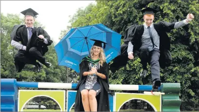  ??  ?? Pictured is David Verdon from Sligo ( right) leaping for joy after graduating from the College of Agricultur­e, Food and Enterprise in Enniskille­n. Also pictured are Peter Flanagan from Maghera and Jessica Finnegan from Newry. There was double joy for David who won The Forging Cup for his skills as a farrier.
