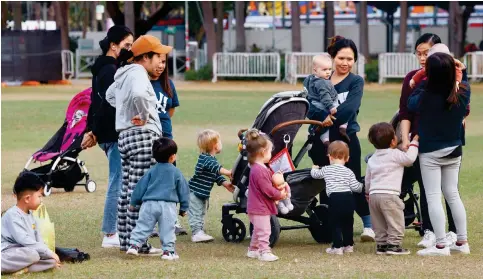  ?? Photo: Dickson Lee ?? Youngsters at play in Victoria Park yesterday. The birth rate fell to a record low in 2022 when the average number of children per woman dropped to 0.9.