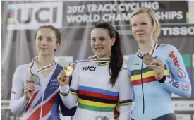  ??  ?? HONG KONG: Gold medalist Rachele Barbieri, center, of Italy, silver medalist Elinor Barker, left, of Great Britain and Bronze medalist Jolien D’Hoore of Belgium pose with their medals on the podium after winning the women’s scratch race at the World...