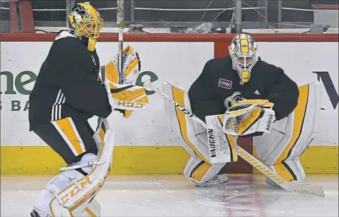  ??  ?? Penguins backup goaltender Casey DeSmith, left, doesn’t see nearly as much time on the ice as starting goalie Matt Murray. That hasn’t kept him from getting acclimated to his adopted home and teammates in Pittsburgh.