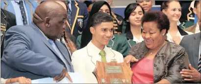  ??  ?? ABOVE: MEC for Finance Mac Jack (left) together with Premier Sylvia Lucas (right) congratula­te the Province’s top achiever Emeleo Dennis Duister from Northern Cape High. LEFT: MEC for the department of Education, Martha Bartlett together with MEC Mac...