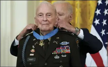  ?? ASSOCIATED PRESS ?? President Joe Biden presents the Medal of Honor to retired U.S. Army Col. Ralph Puckett on May 21, 2021, in the East Room of the White House.