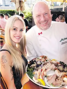  ??  ?? Dani Le Rose sang The Tide and executive chef Wayne Sych toted a Seafood Tower dish at Joe Fortes restaurant’s summertime patio opening.