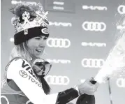  ?? MARCO TROVATI AP ?? American Mikaela Shiffrin celebrates after winning the World Cup giant slalom, in Kronplatz, Italy, on Tuesday.
