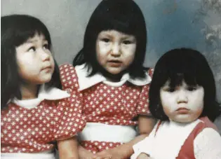  ??  ?? Colleen Cardinal (right) and her sisters Patti (left) and Gina in 1975, after being adopted.