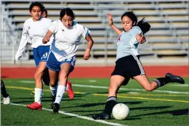  ?? RECORDER PHOTO BY NAYIRAH DOSU ?? Granite Hills High School’s Tanya Gorgonio scores during the second half of an East Sequoia League girls soccer game against Corcoran High School,