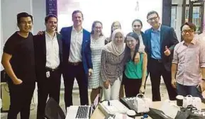  ??  ?? Harvard Business School students with Media Prima Digital chief executive officer Rafiq Razali (right) and Media Prima Labs general manager Nicholas Sagau (left) during a brainstorm­ing session in Sri Pentas, Kuala Lumpur, yesterday.