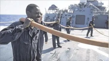  ?? CONTRIBUTE­D PHOTOS ?? Seaman Dominique Dunn of Atlanta is serving aboard the USS Ross.