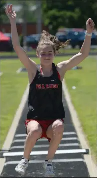  ?? (NWA Democrat-Gazette/Andy Shupe) ?? Cassidy Mooneyhan of Pea Ridge, shown competing in the long jump at the state heptathlon a year ago at Ramay Junior High School in Fayettevil­le, set the Class 4A girls state pole vault record in 2019 at 12 feet, 7 inches.