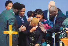  ?? MATT ROURKE/ASSOCIATED PRESS ?? Tiffany Whitfield, a granddaugh­ter of 86-year-old Ruth Whitfield, a victim of a shooting at a supermarke­t in Buffalo, N.Y., is overwhelme­d with emotion during a news conference Monday.