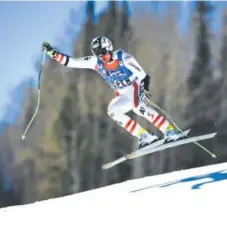  ??  ?? Hannes Reichelt takes some air en route to victory Thursday in the men’s super-G in Aspen. Helen H. Richardson, The Denver Post