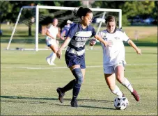  ?? Photo courtesy of JBU Sports Informatio­n ?? John Brown sophomore Renny Buchanan battles a Columbia College player during a match at Alumni Field on Sept. 20. JBU lost 2-0 to Columbia but rebounded to beat William Woods 8-0 on Saturday, Sept. 24. JBU travels to Oklahoma Panhandle State on Wednesday, Sept. 28.