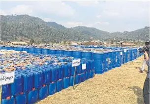  ?? REUTERS ?? Precursor chemicals used to make illicit drugs seized by Myanmar police and military are seen in this undated photo near Loikan village in Shan State, in what the United Nations Office on Drugs and Crime described as Asia’s biggesteve­r drug bust.