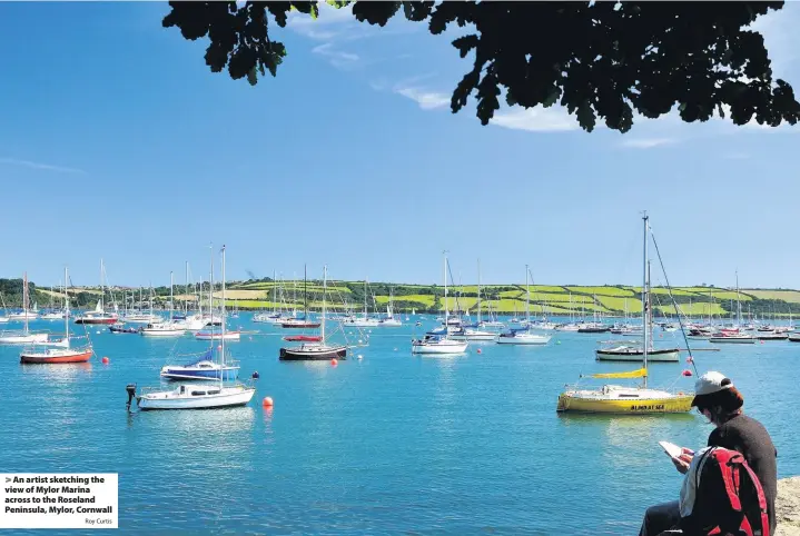  ?? Roy Curtis ?? An artist sketching the view of Mylor Marina across to the Roseland Peninsula, Mylor, Cornwall