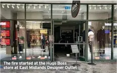  ?? ?? The fire started at the Hugo Boss store at East Midlands Designer Outlet